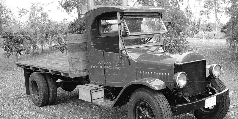 A vintage Atlas Roofing company vehicle from the early years of the business